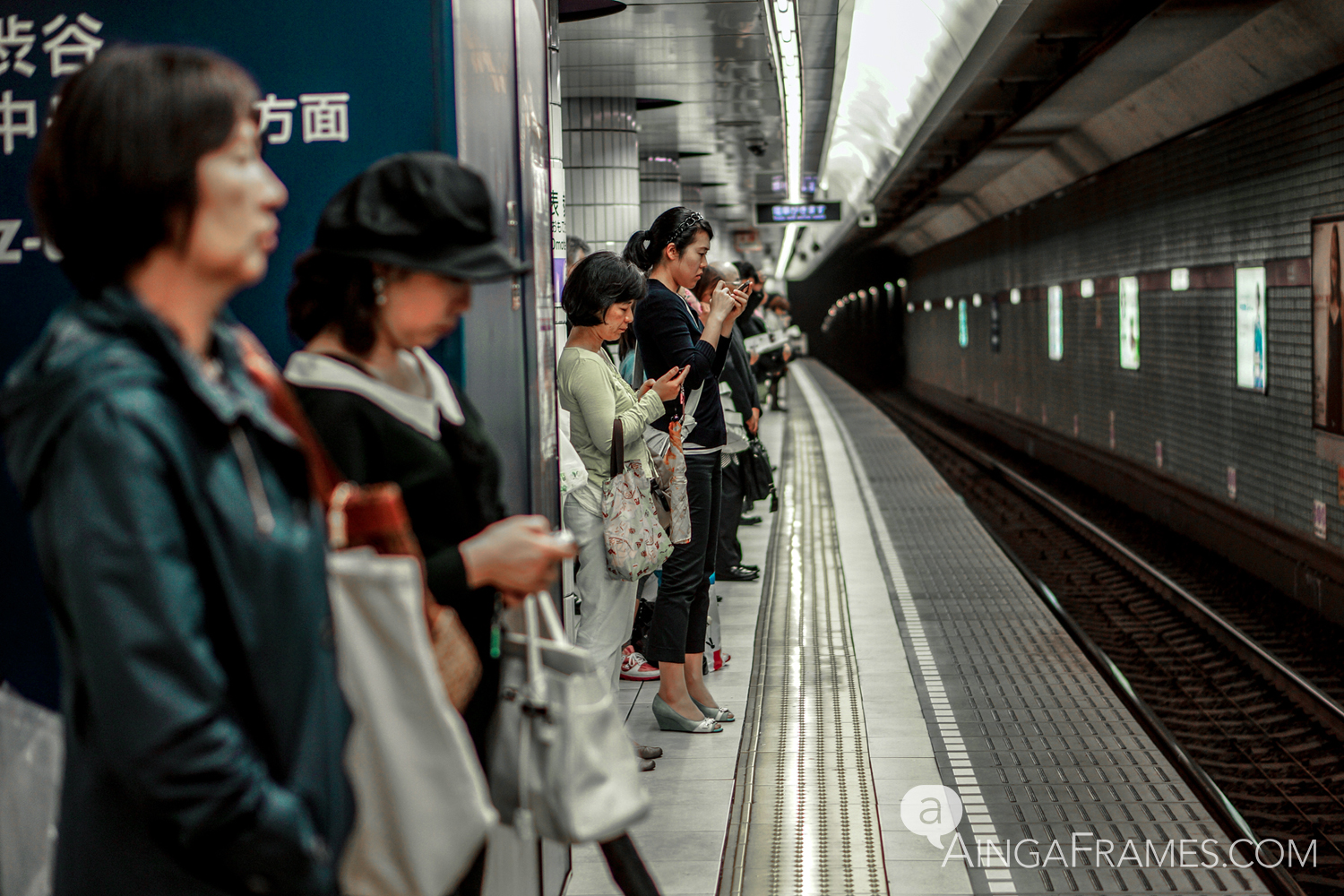 The brief pause on the subway platform is best spent checking the smartphone.