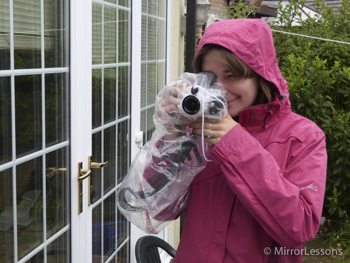 The EVF works just fine with the plastic cover.