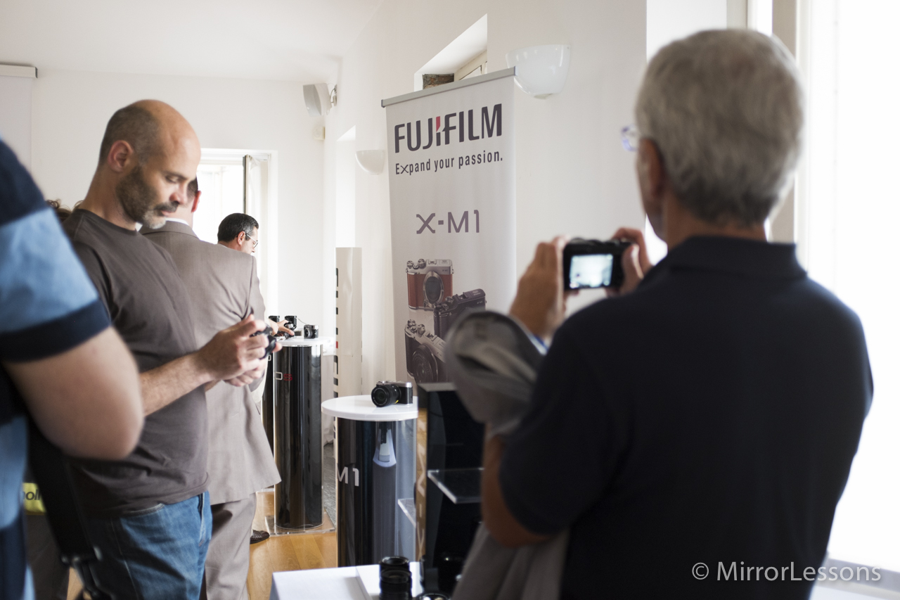 The conference room is full and everyone is testing out the X-M1.