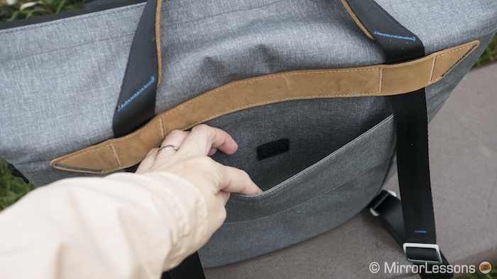 Slide the bag onto your luggage handle via the provided pass-through